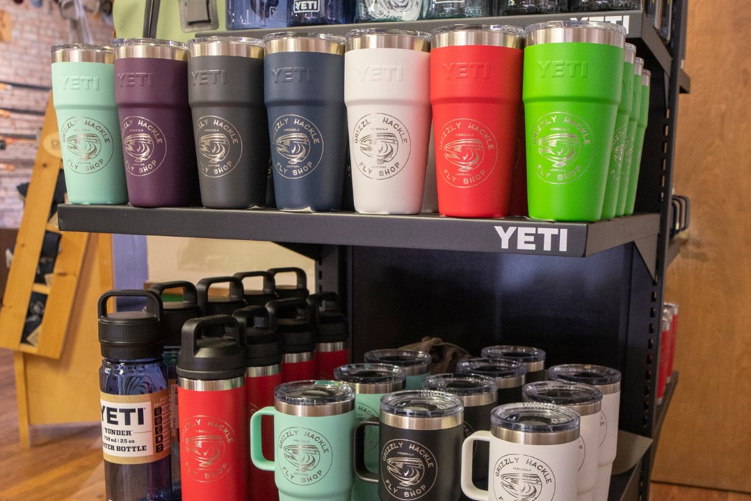 different colors of insulated drinkware with Grizzly Hackle's shop logo