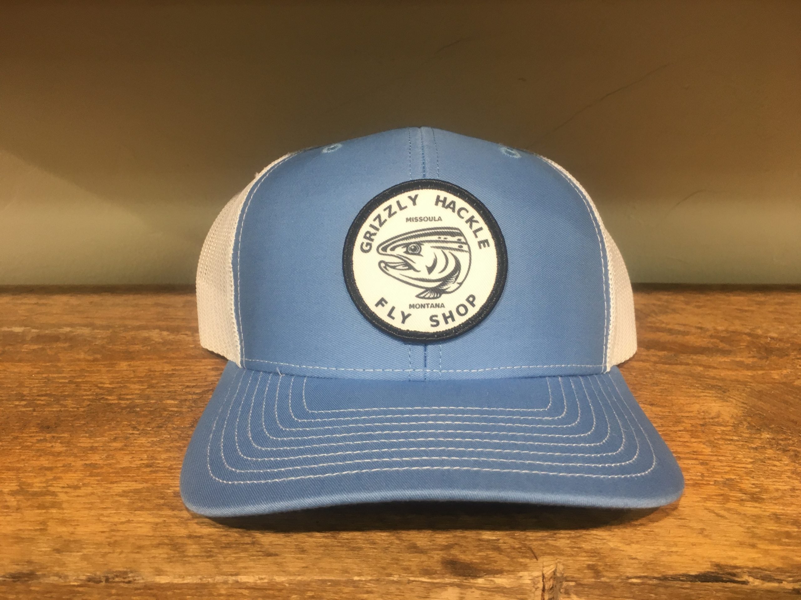 Grizzly Hackle Circle Fish Logo Trucker Hat