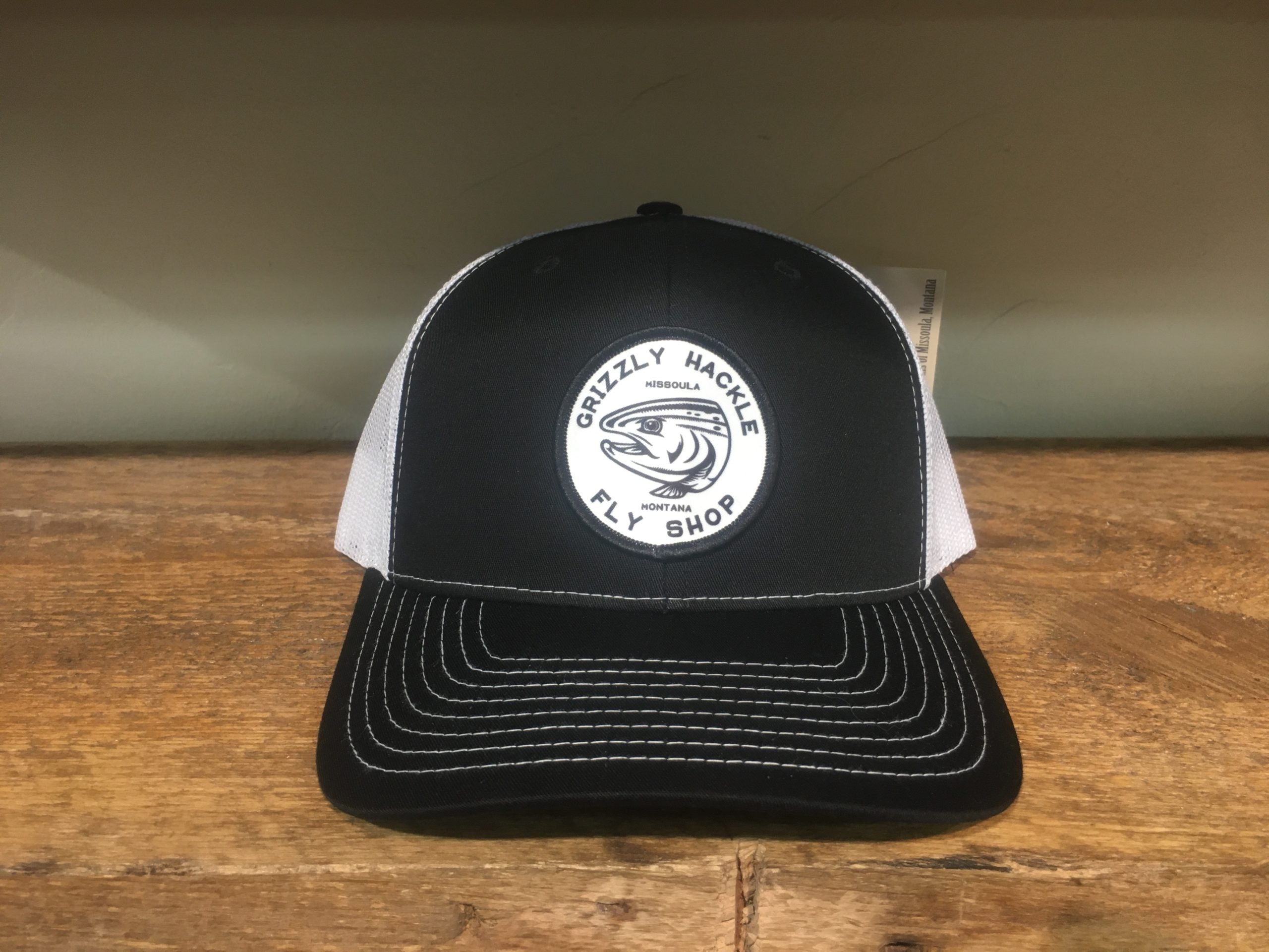 Grizzly Hackle Circle Fish Logo Trucker Hat