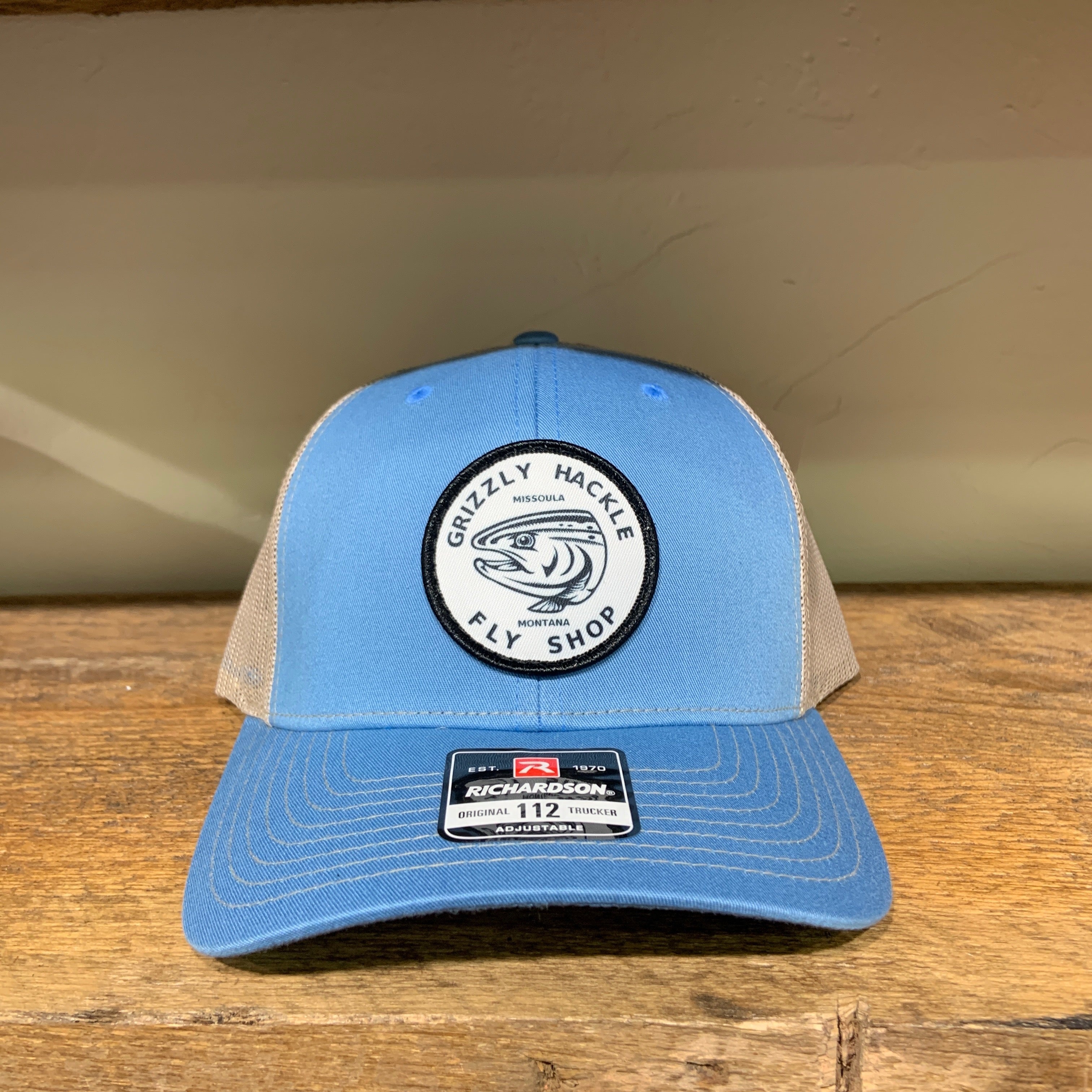 Grizzly Hackle Circle Fish Logo Trucker Hat