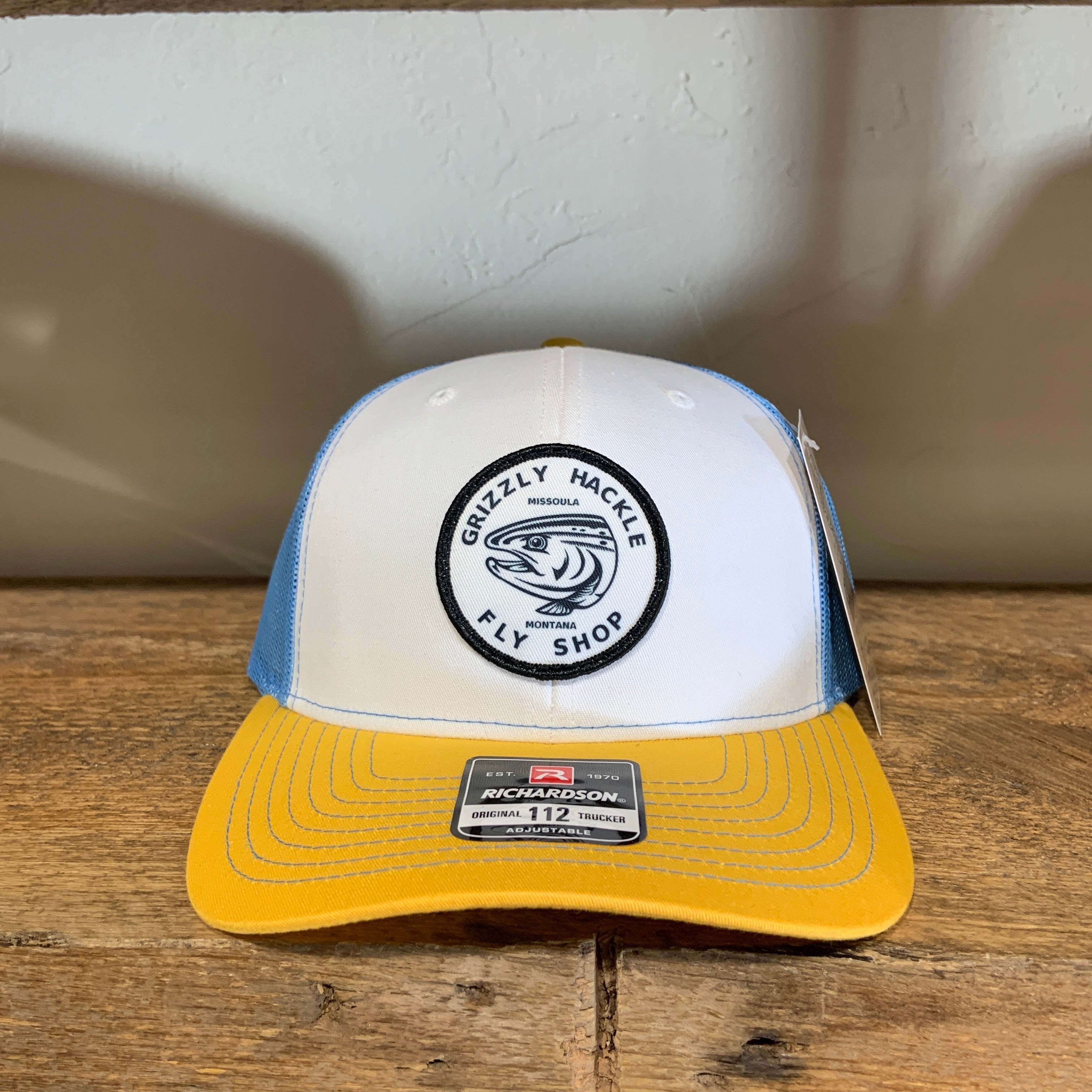 Grizzly Hackle Circle Fish Logo Trucker Hat