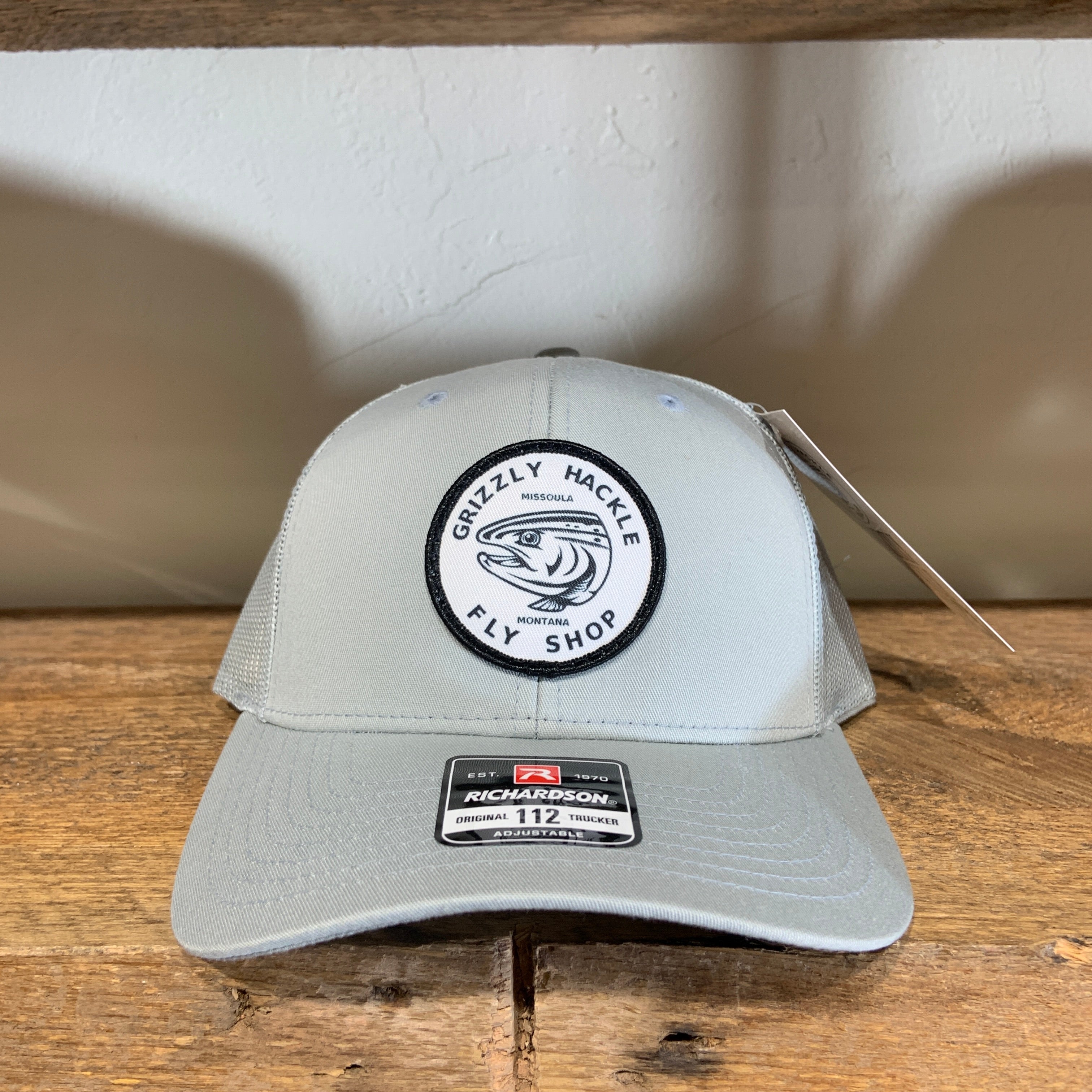 Grizzly Hackle Circle Fish Logo Trucker Hat