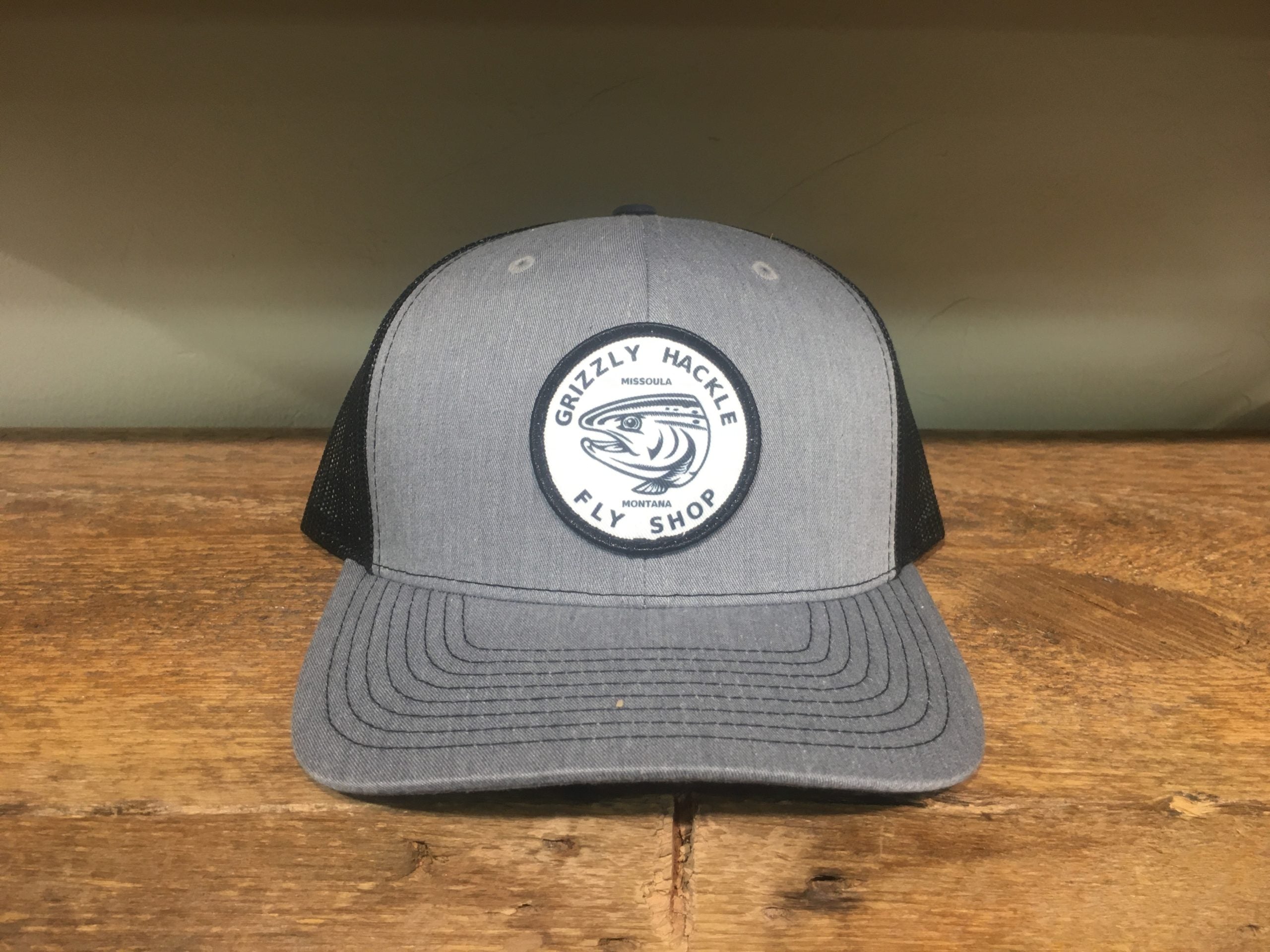 Grizzly Hackle Circle Fish Logo Trucker Hat