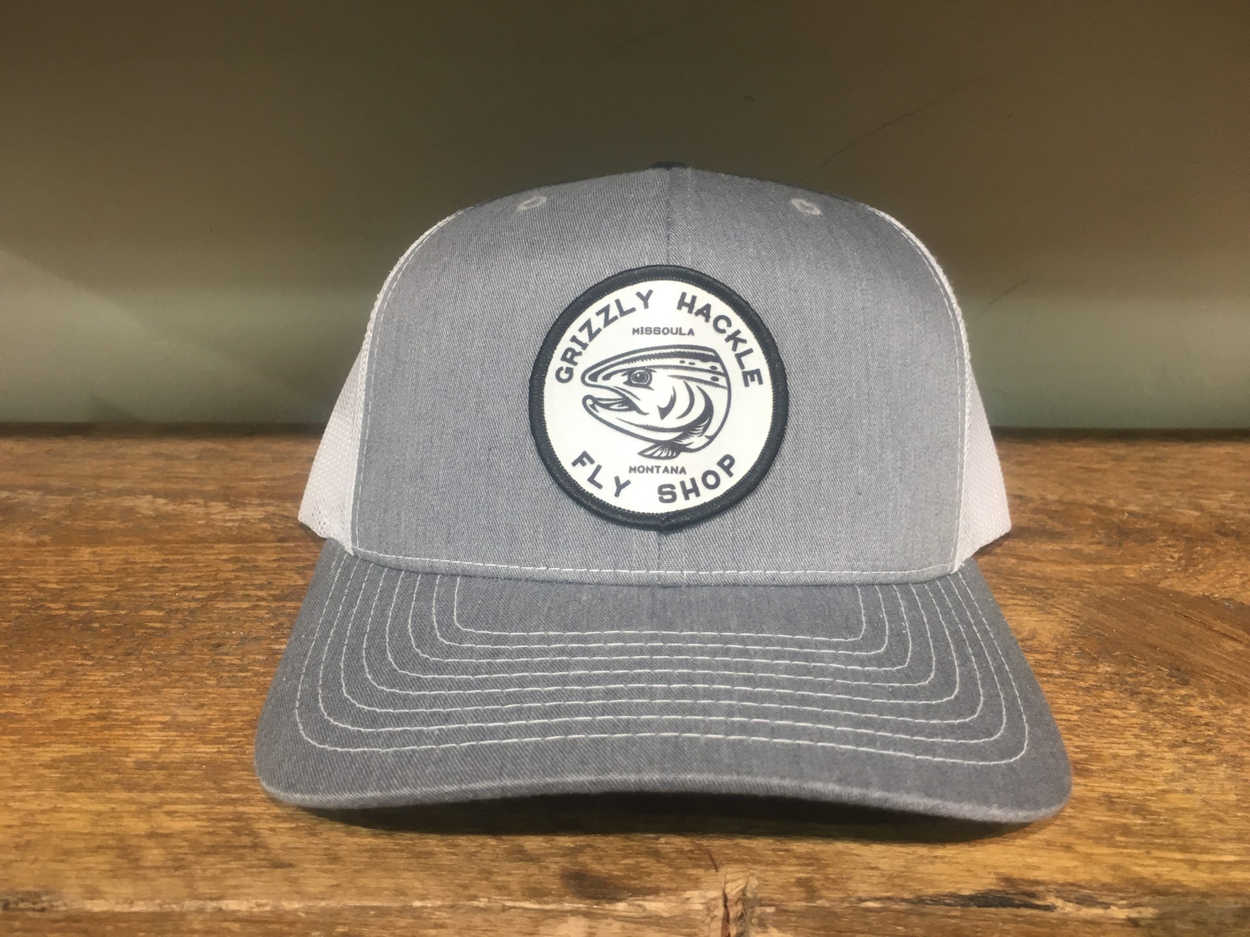 Grizzly Hackle Circle Fish Logo Trucker Hat