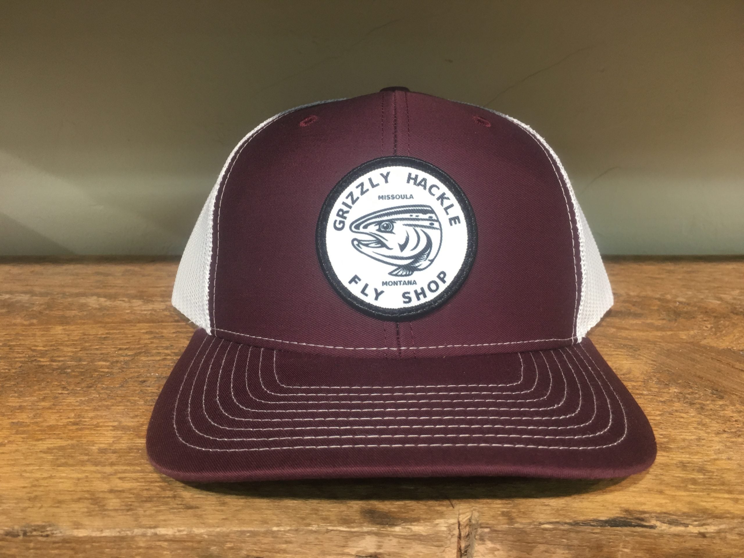 Grizzly Hackle Circle Fish Logo Trucker Hat