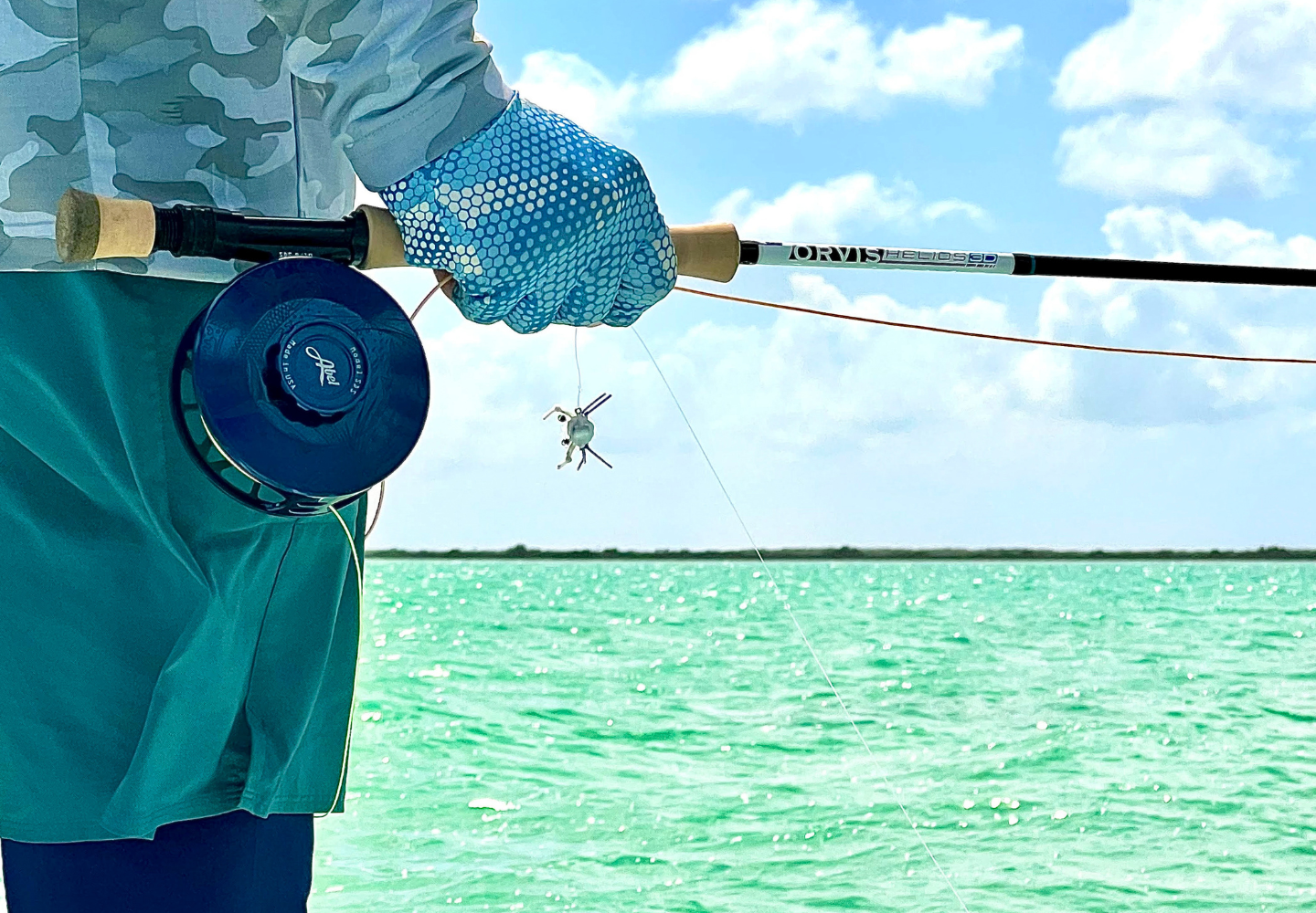 man looks for bonefish while fly fishing in mexico